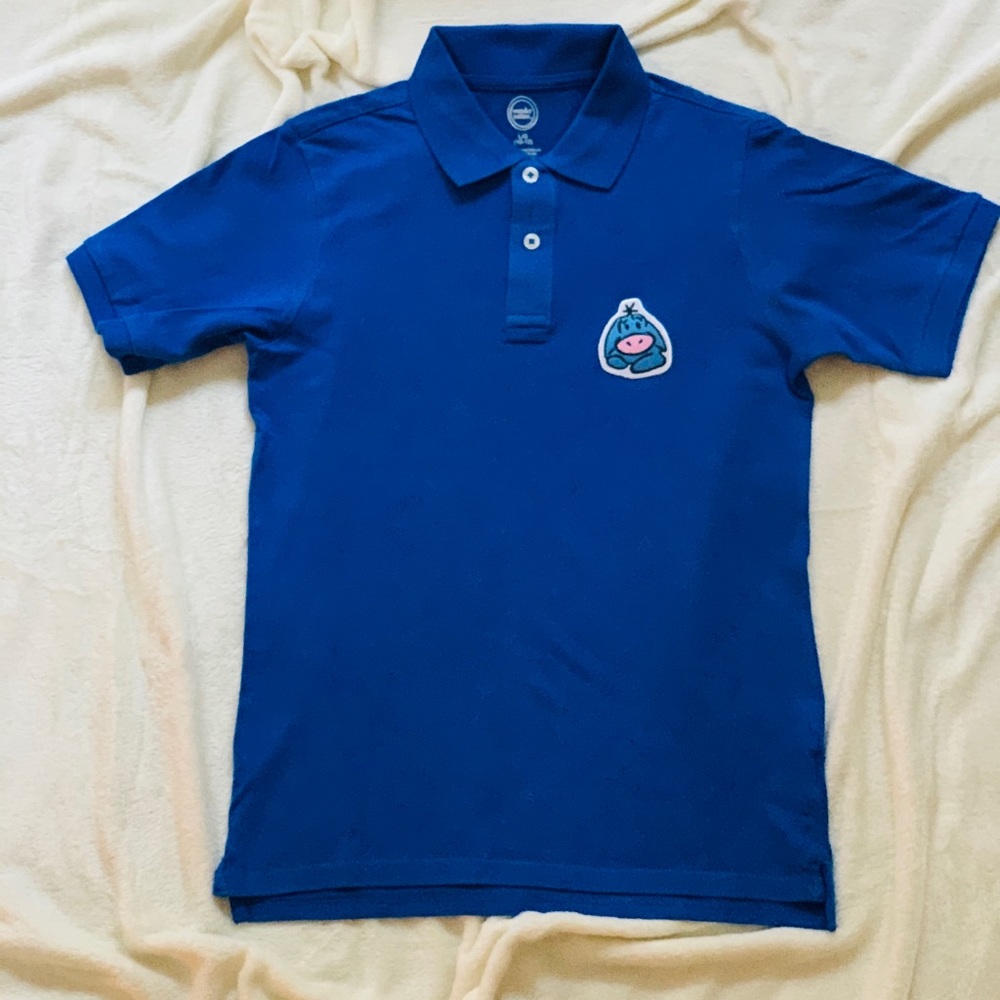 Boys Royal Blue Polo with Eyerore Patch.